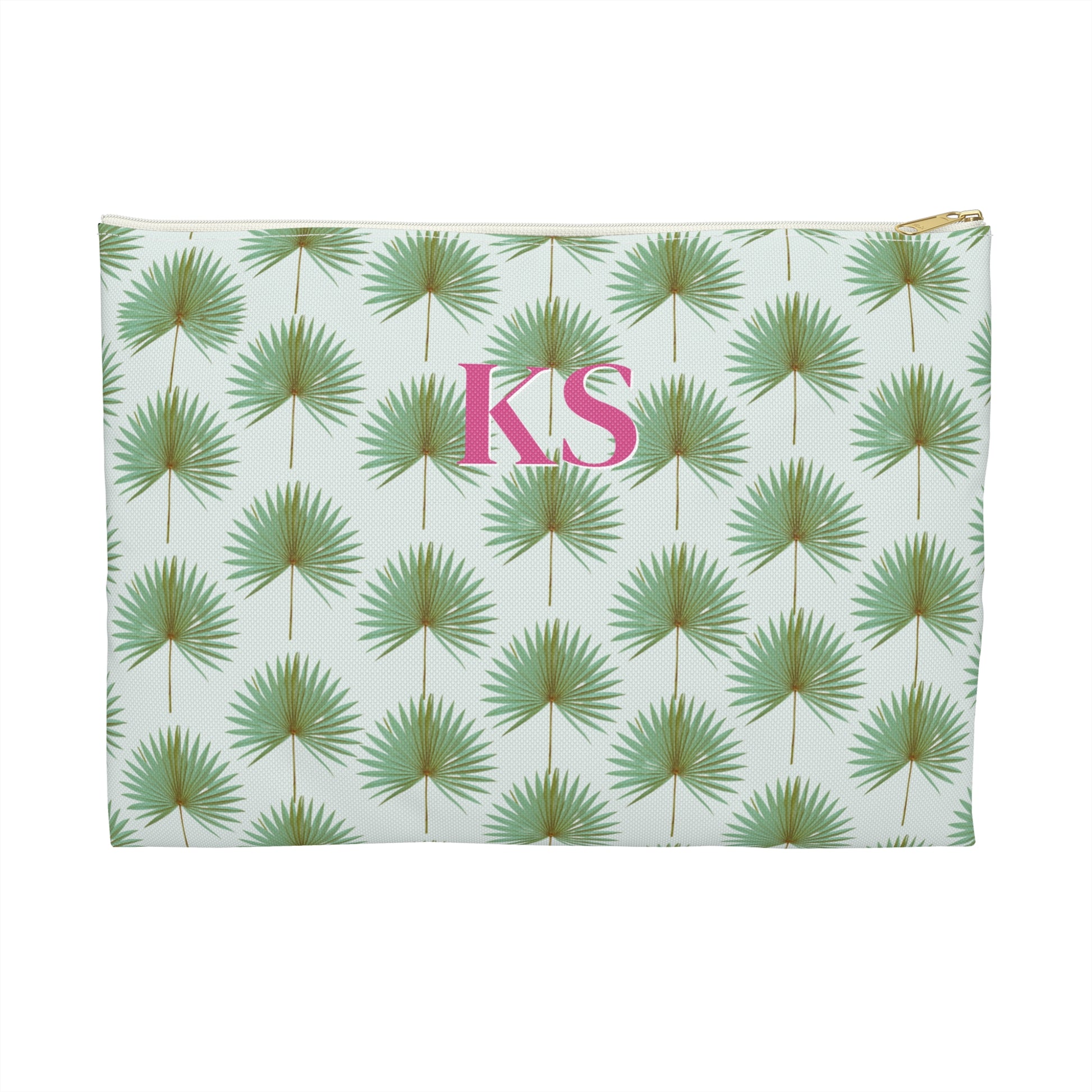 Monogrammed cosmetic travel bag with repeating pattern of green fan palm leaves on white background