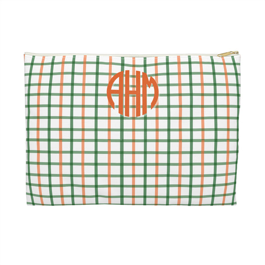 Green and orange checkered pouch with monogram on a white background