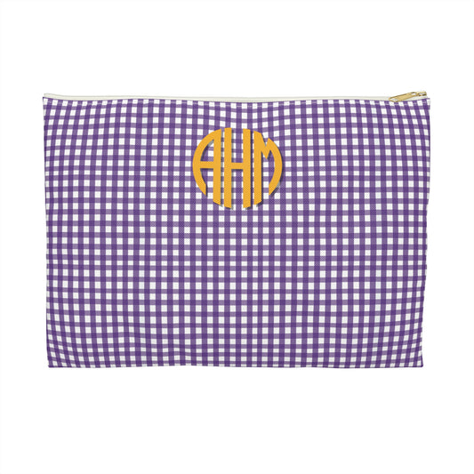 Purple and white checkered pouch with yellow monogram on a white background