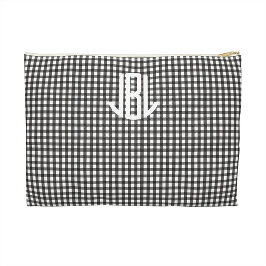 Black and white checkered pouch with 'JBL' monogram on a white background