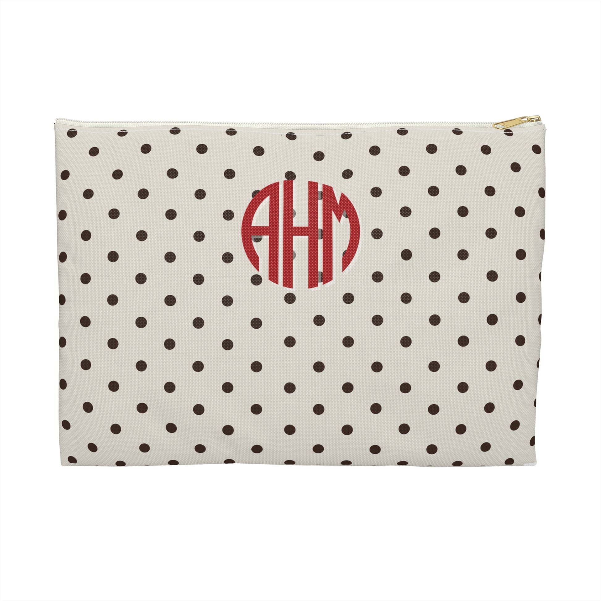 Polka dot pouch with red monogram on a white background