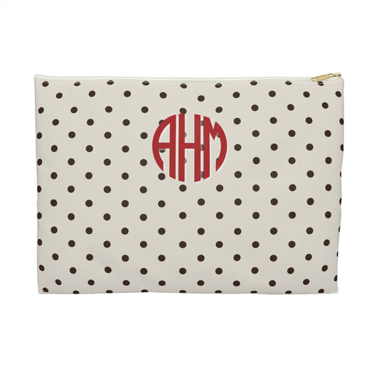 Polka dot pouch with red monogram on a white background