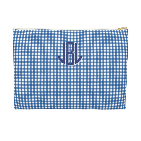 Blue and white checkered pouch with initials 'JL' on a white background