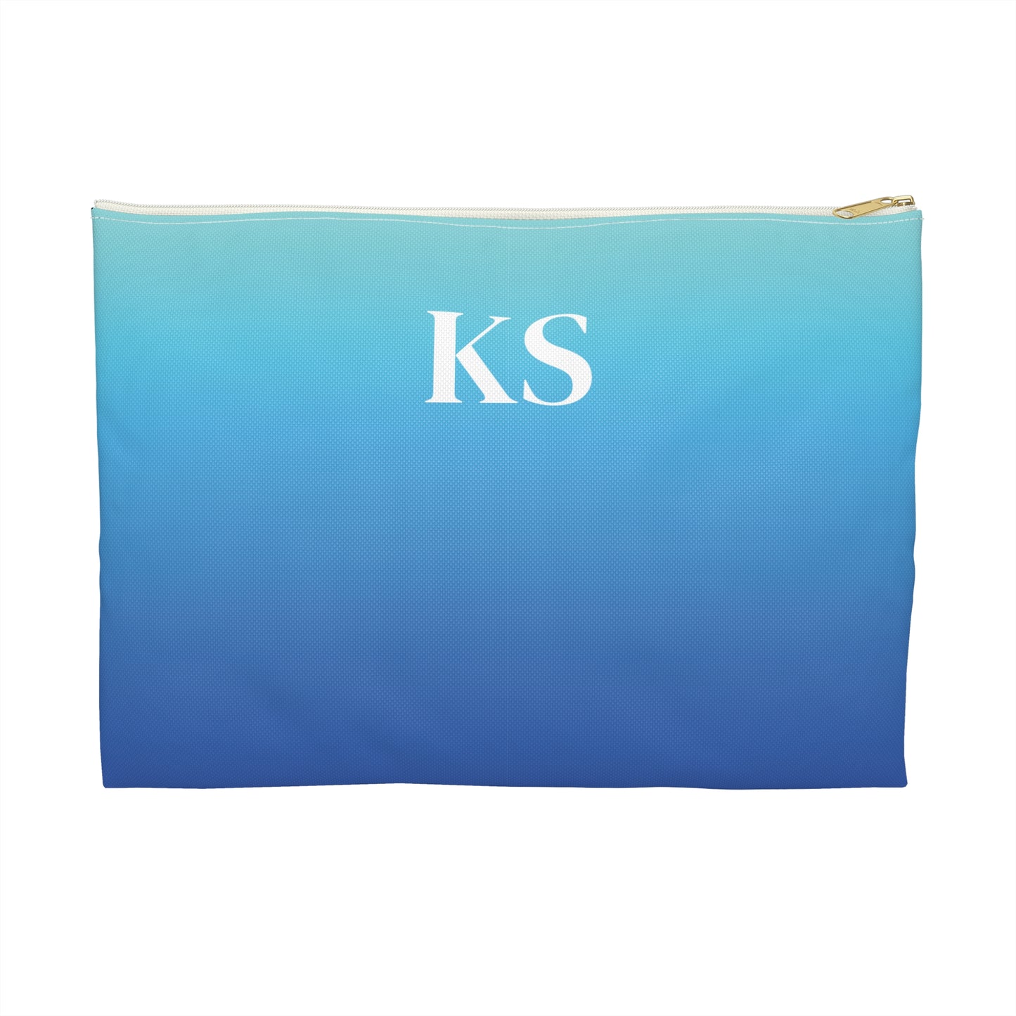 monogrammed personalized cosmetic travel bag on gradient turquoise background