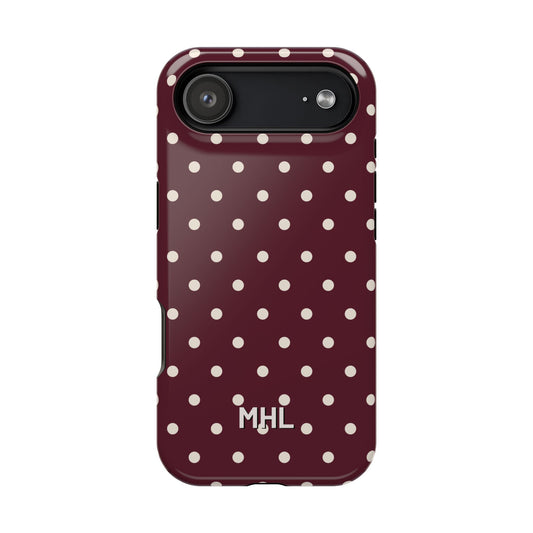 Phone case with white polka dots and 'MHL' branding on a white background
