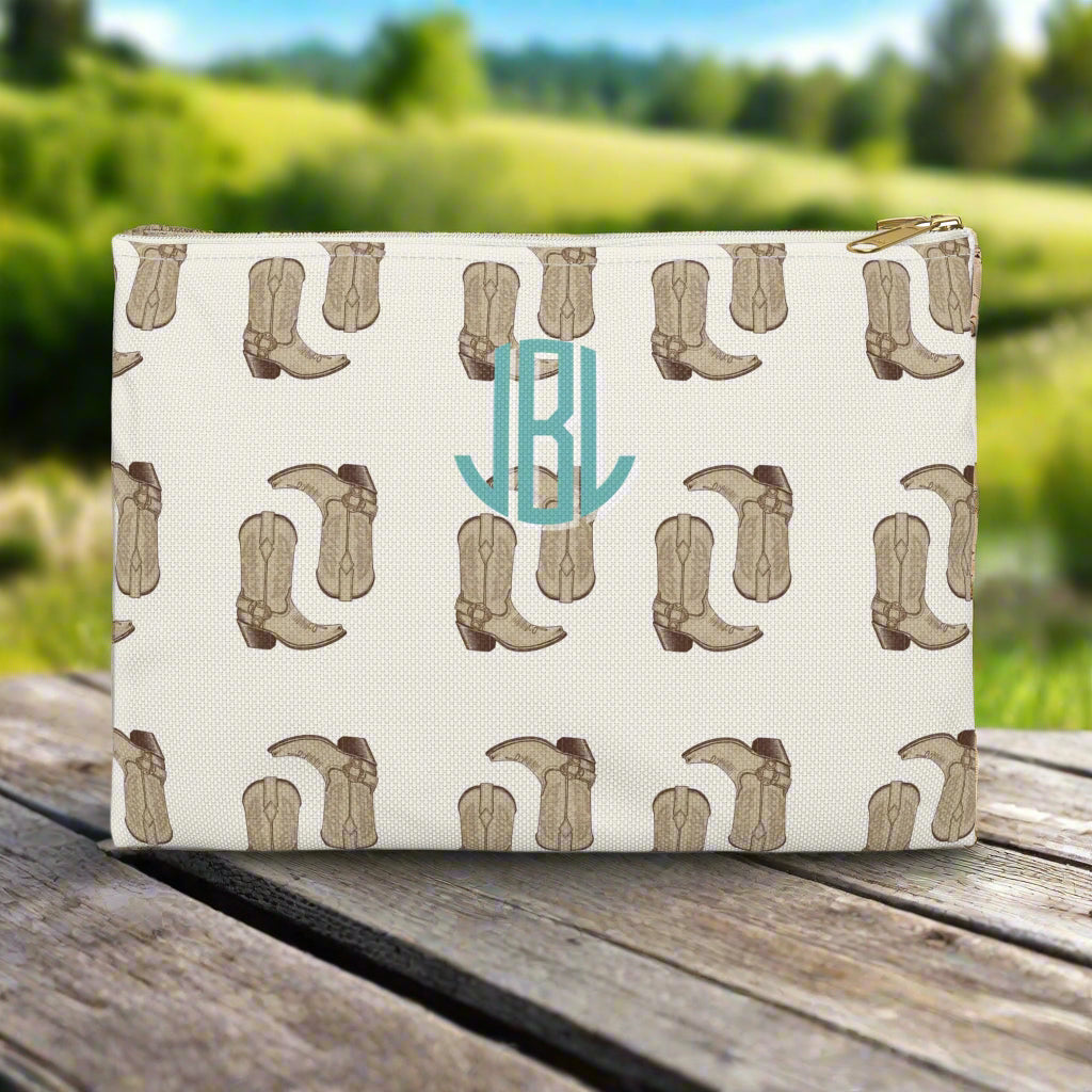 Pouch with cowboy boot pattern and initials 'JBL' on a white background