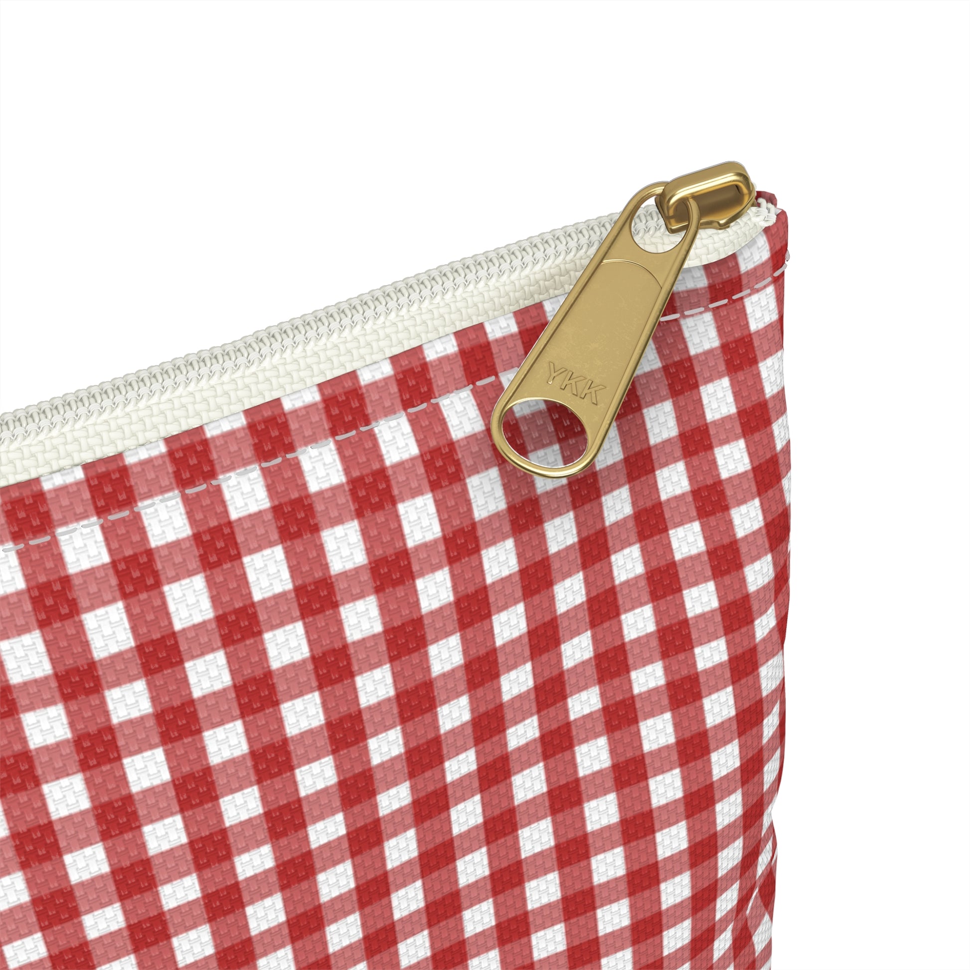 Red and white checkered pouch with a gold zipper pull on a white background