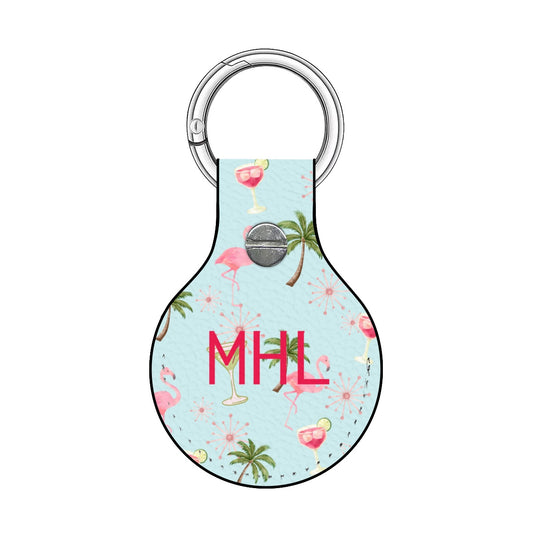 Keychain with tropical design and 'MHL' initials on a light blue background