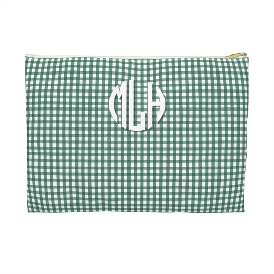 Green gingham pouch with white monogram on a white background
