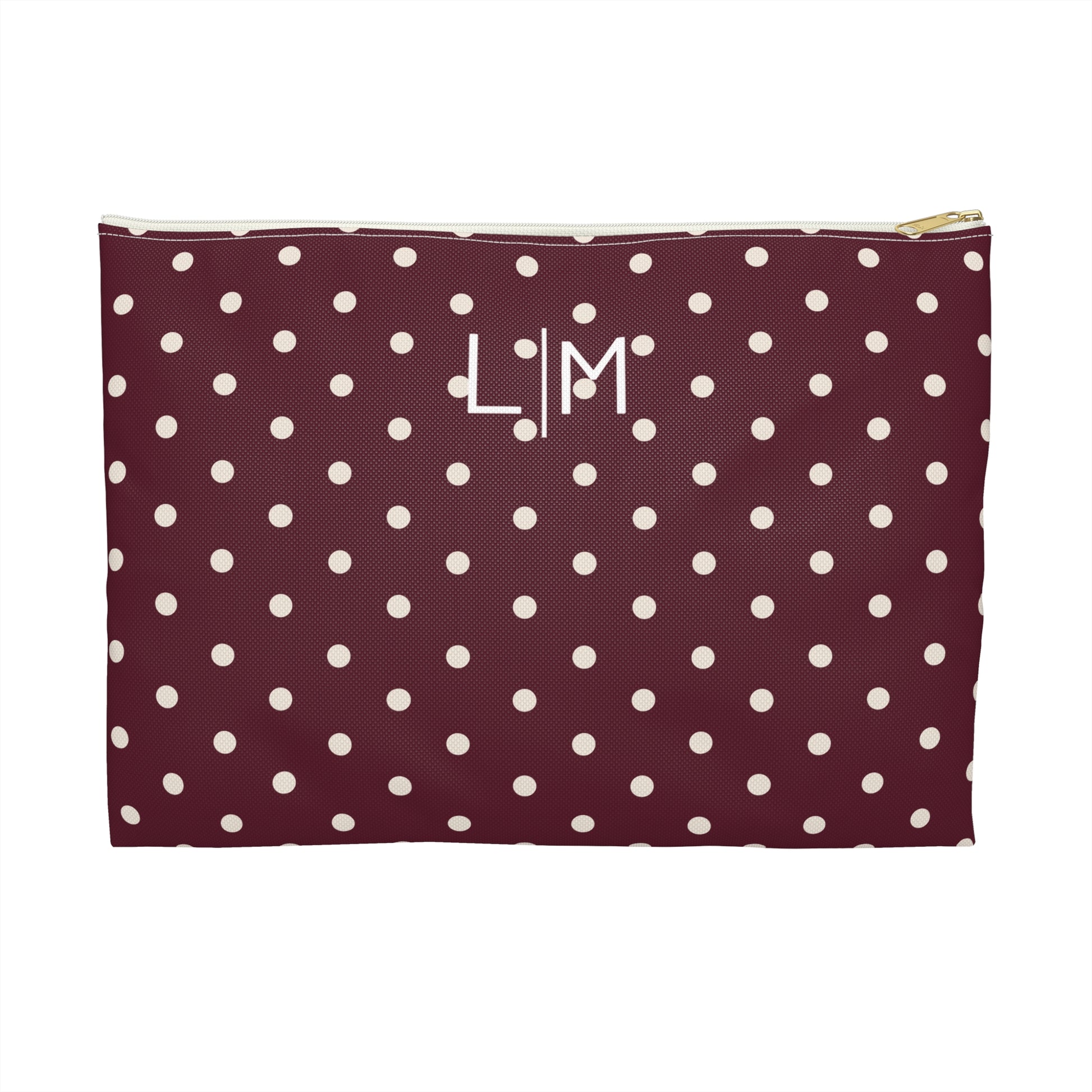Polka dot pouch with initials on a white background