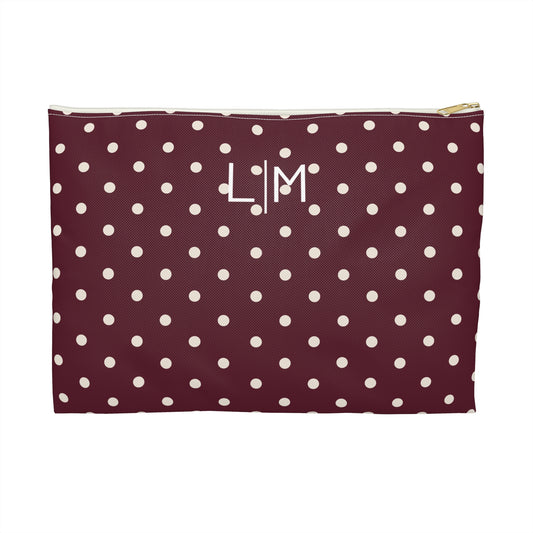 Polka dot pouch with initials on a white background