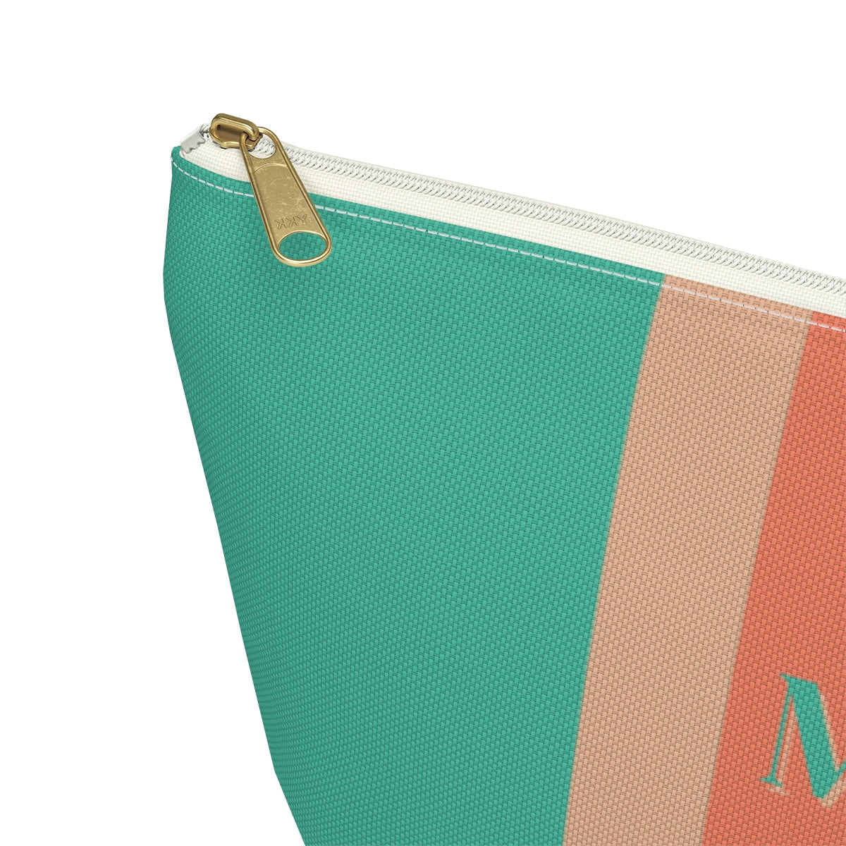 close up view of gold zipper of Monogrammed cosmetic travel bag with orange and turquoise stripes 