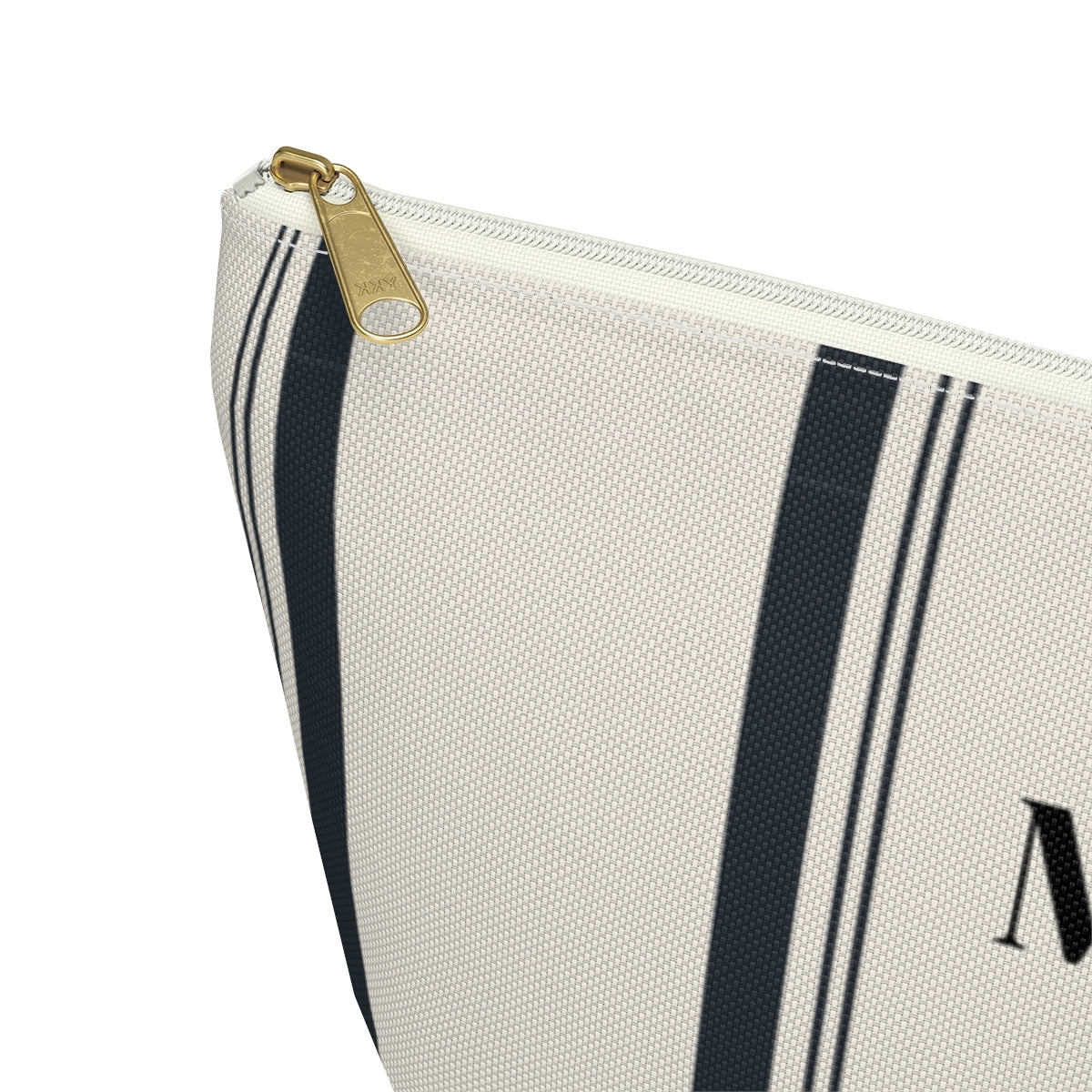 closed up of personalized black and cream striped  cosmetic travel bag with black monogram