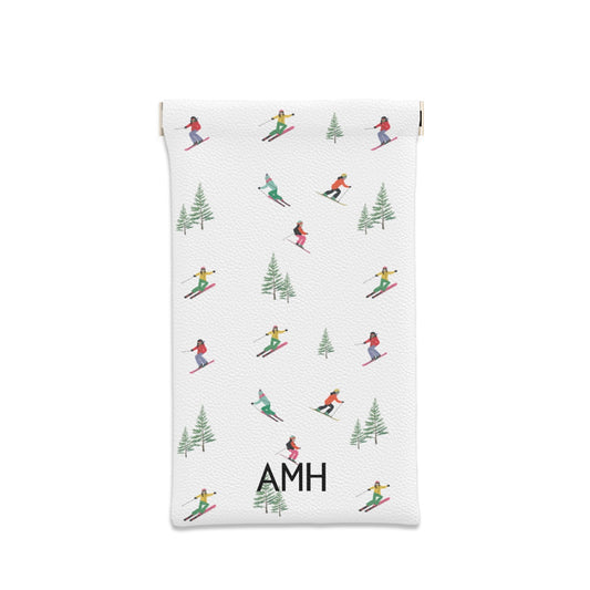 sunglasses case with repeating pattern of skiers and pine trees