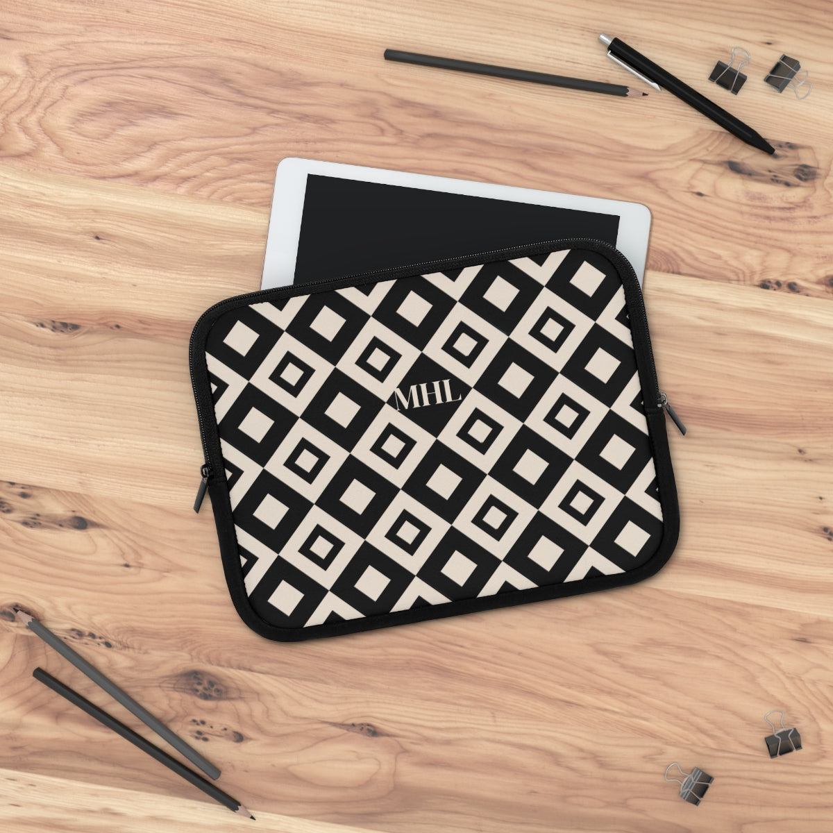 monogrammed  neoprene laptop case in a black and cream repeating diamond print