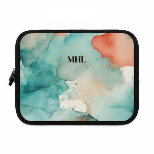 Monogrammed neoprene laptop sleeve with a cream, turquoise, and orange abstract watercolor print on the front