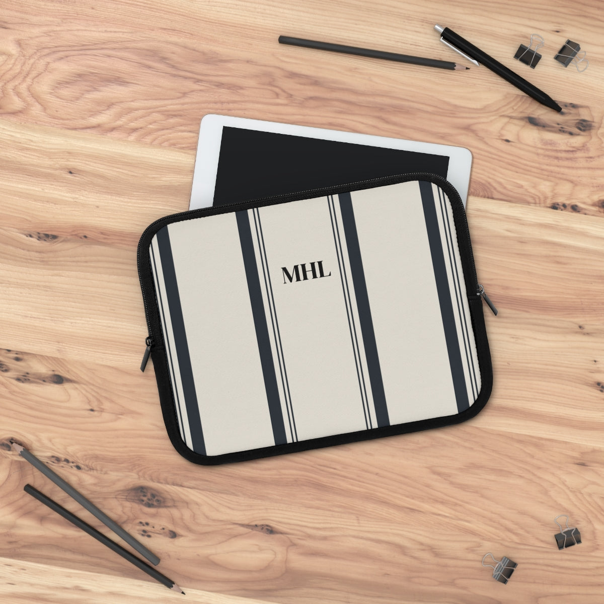 monogrammed neoprene laptop case in cream with multiple vertical black stripes 