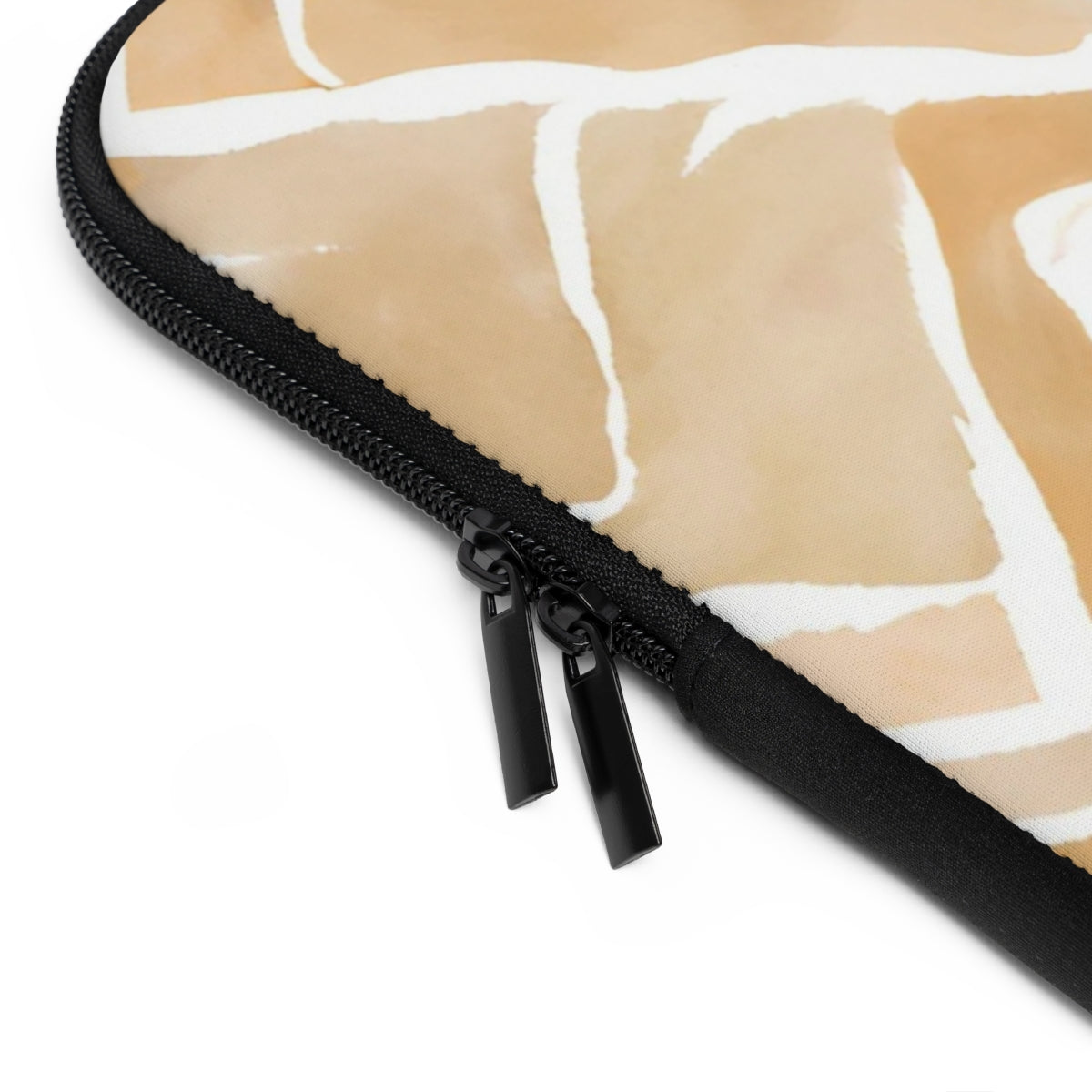 close up of zipper on a Monogrammed neoprene laptop case in a light tan, apricot  and cream abstract pattern 