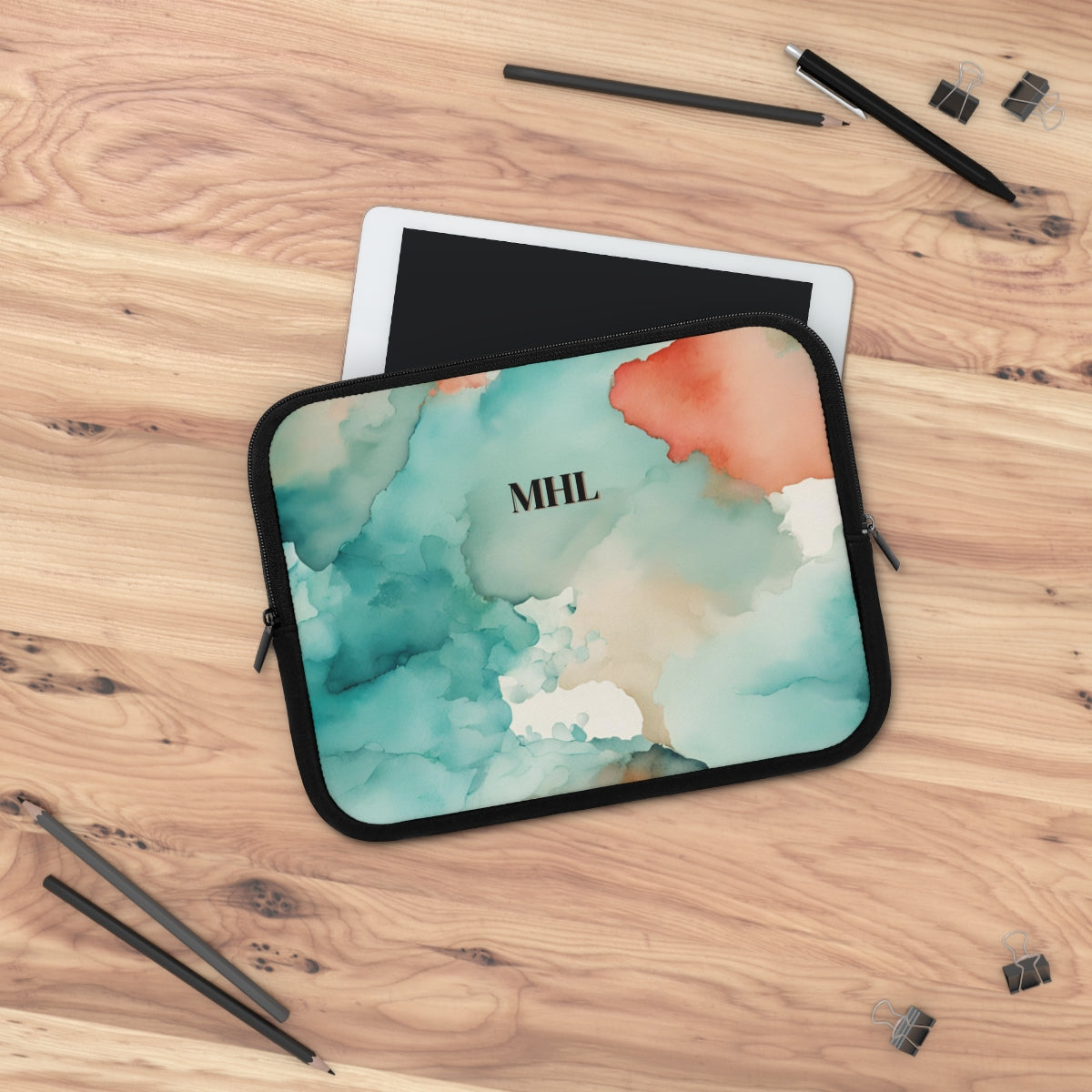 Monogrammed neoprene laptop sleeve with a cream, turquoise, and orange abstract watercolor print on the front