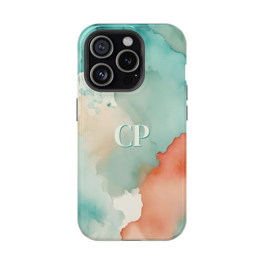 personalized magnetic tough iPhone case with cream monogram on an abstract watercolor background in turquoise, coral, and cream