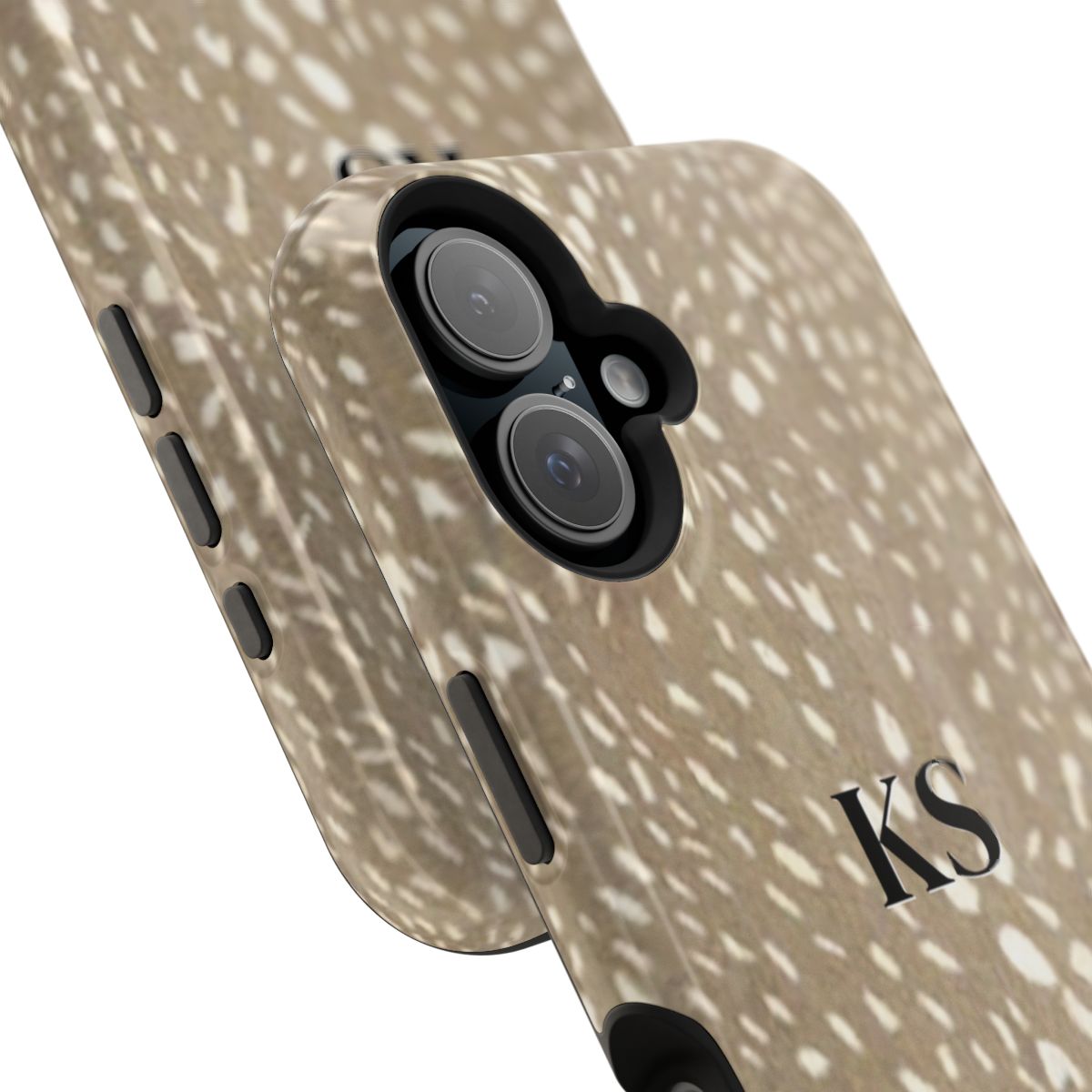 Close up view of camera on personalized magnetic tough iPhone case with black monogram on a spotted deer print pattern background in tan and cream