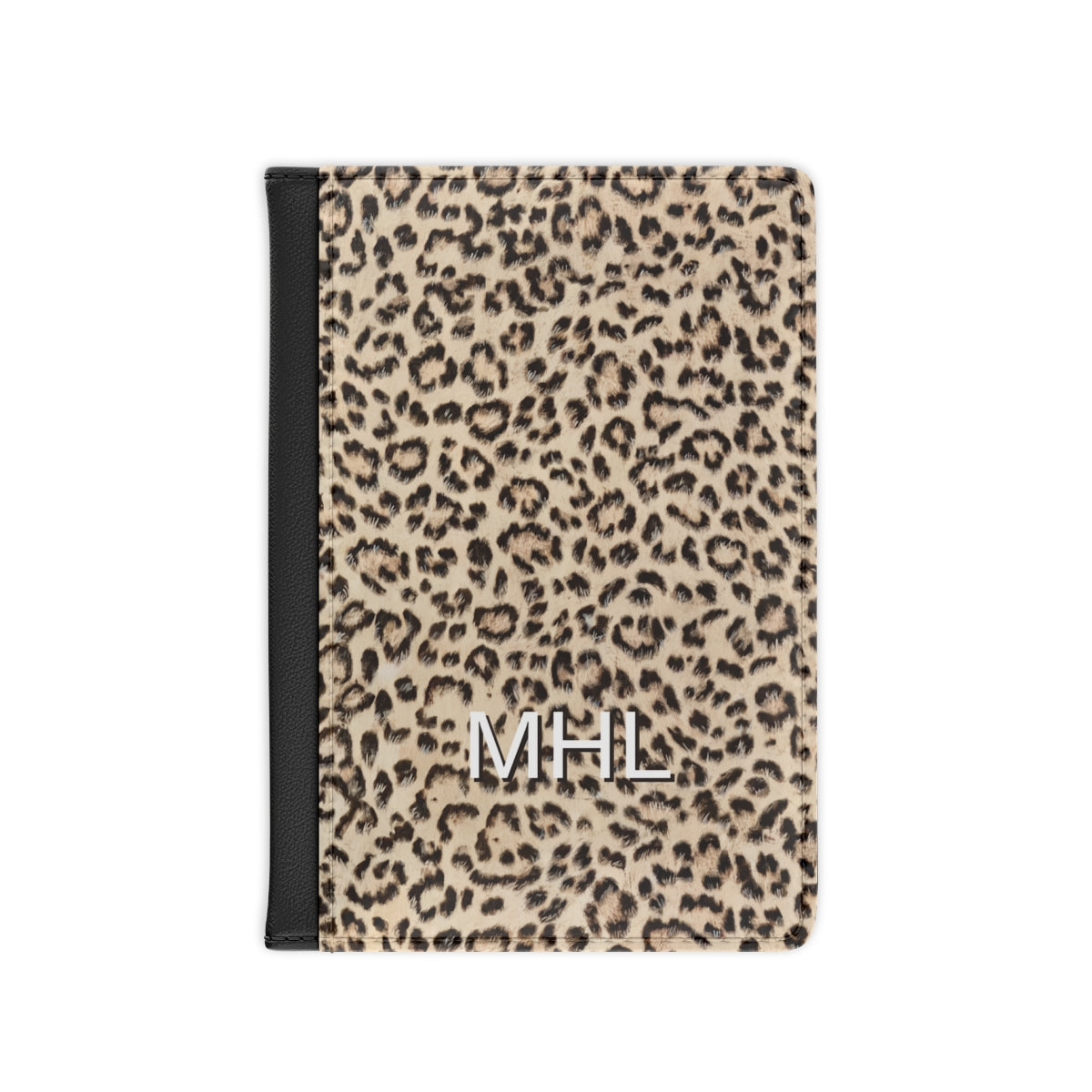 front view of personalized passport cover with white monogram on a leopard print background