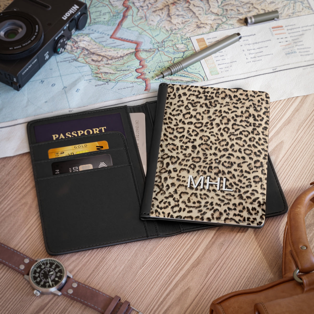 front view of personalized passport cover with white monogram on a leopard print background