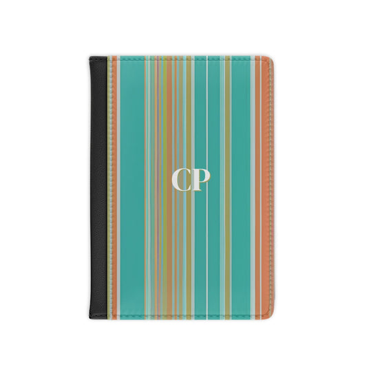 personalized passport cover with monogram on an background of vertical stripes in turquoise, coral and yellow