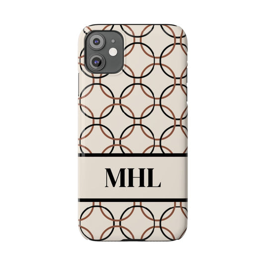 personalized slim iPhone case with black monogram on a cream background with repeating design of interlocking brown and black circles