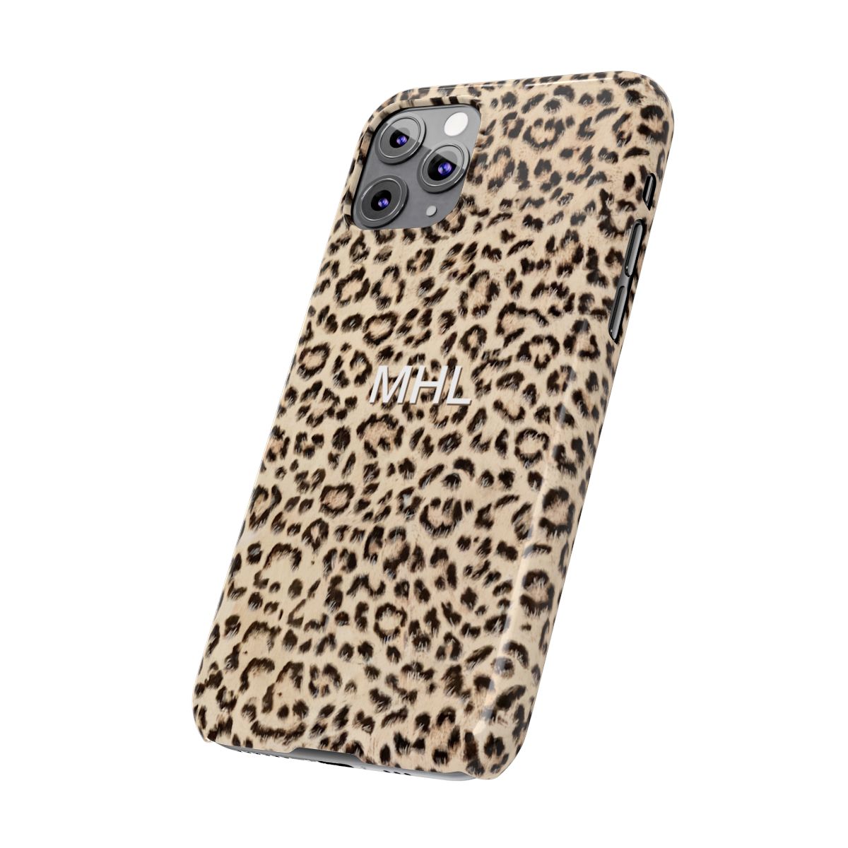 angled front view of personalized slim iPhone case with white monogram on a cheetah print background